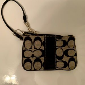 Coach Large Wristlet In Signature Canvas